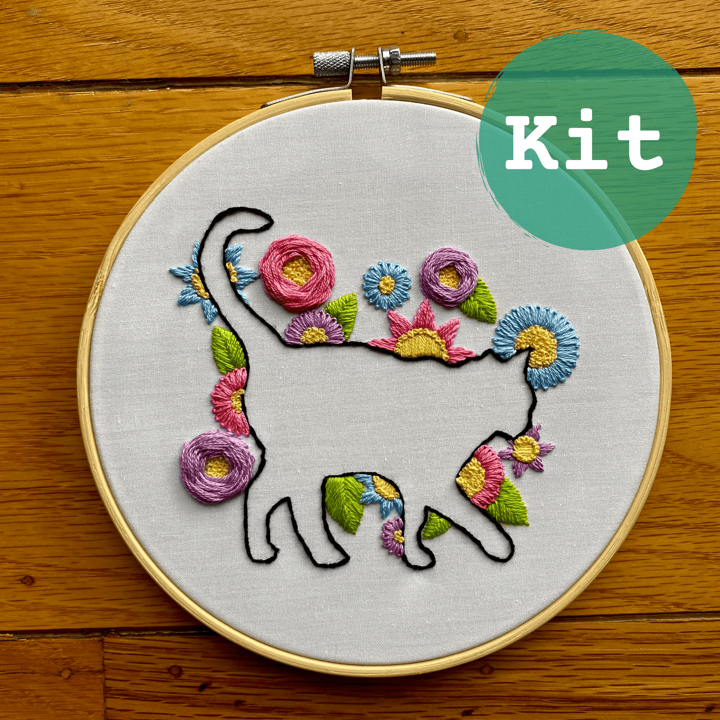 Cat In Bloom Embroidery Kit with floral design on bamboo hoop, ideal for beginner stitching skills.