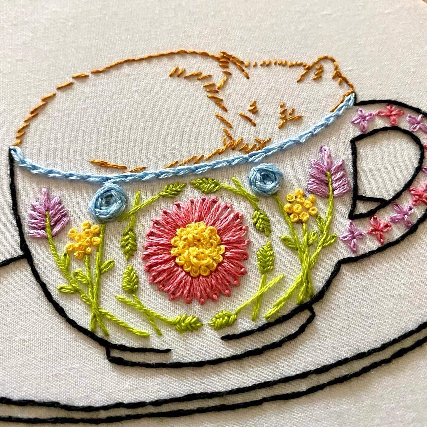 Beginner-friendly Catpuccino embroidery with floral mug and sleepy cat design.