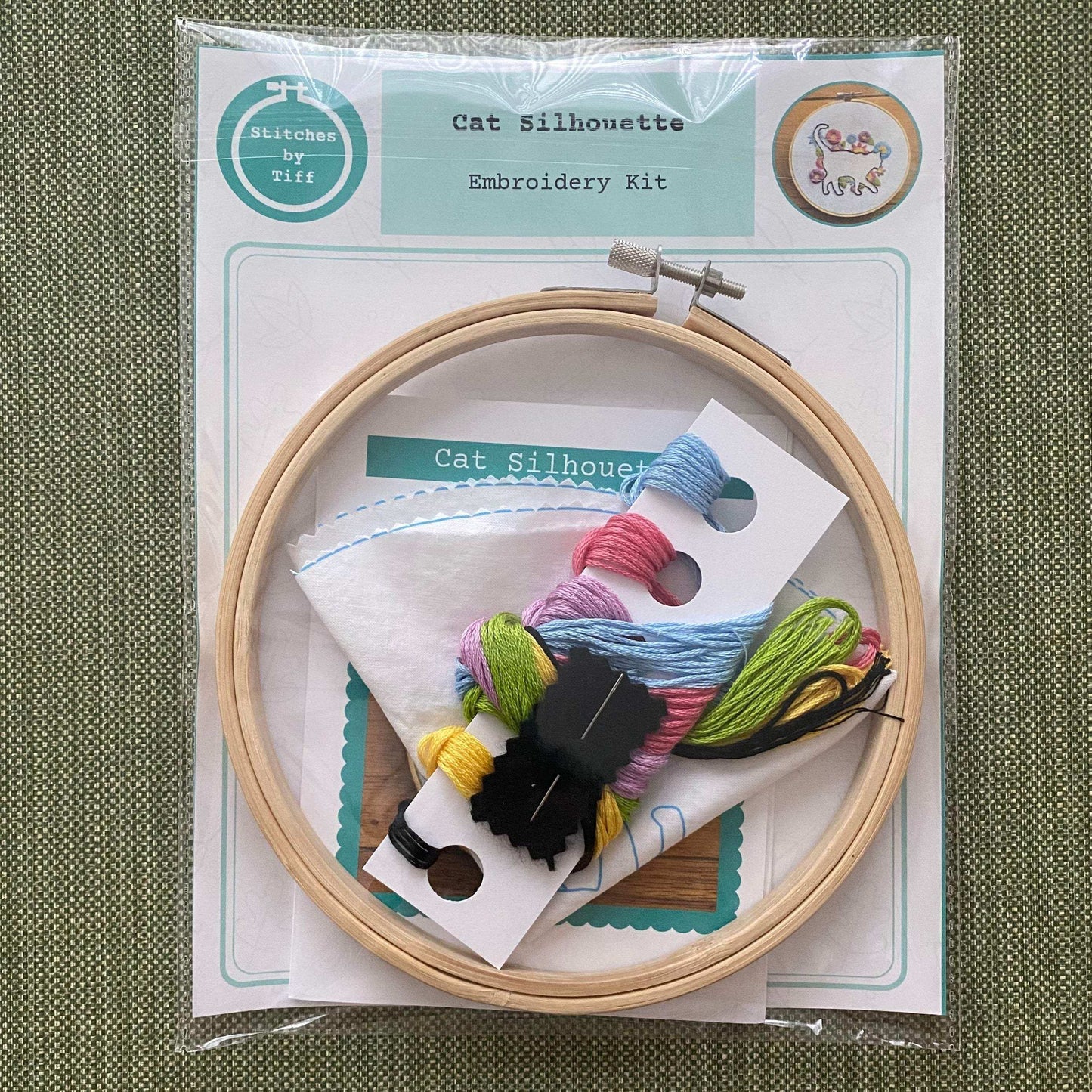 Cat In Bloom Embroidery Kit with hoop, threads, and fabric for beginner stitching.