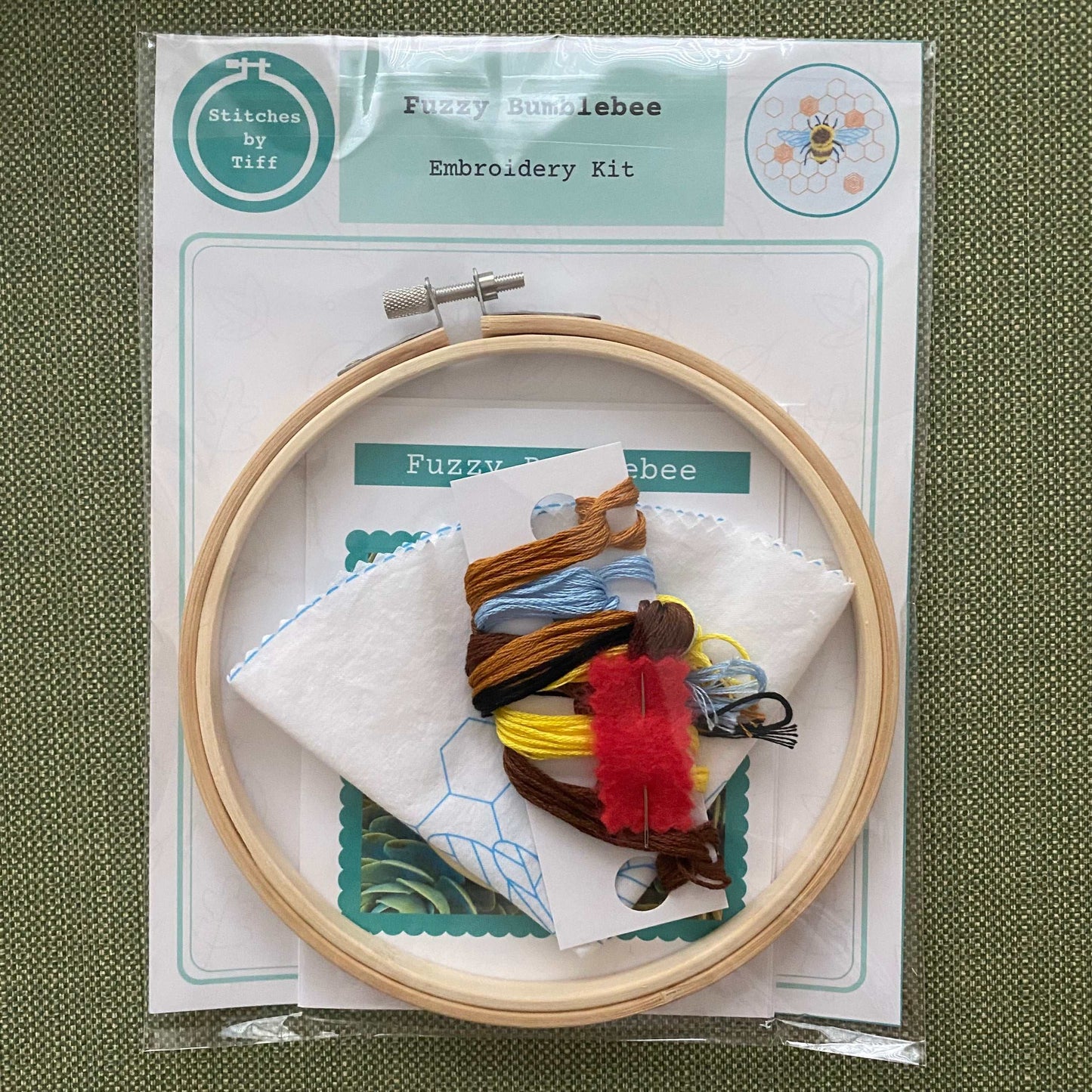 Fuzzy Bumblebee Embroidery Kit with hoop, threads, and fabric for crafting.