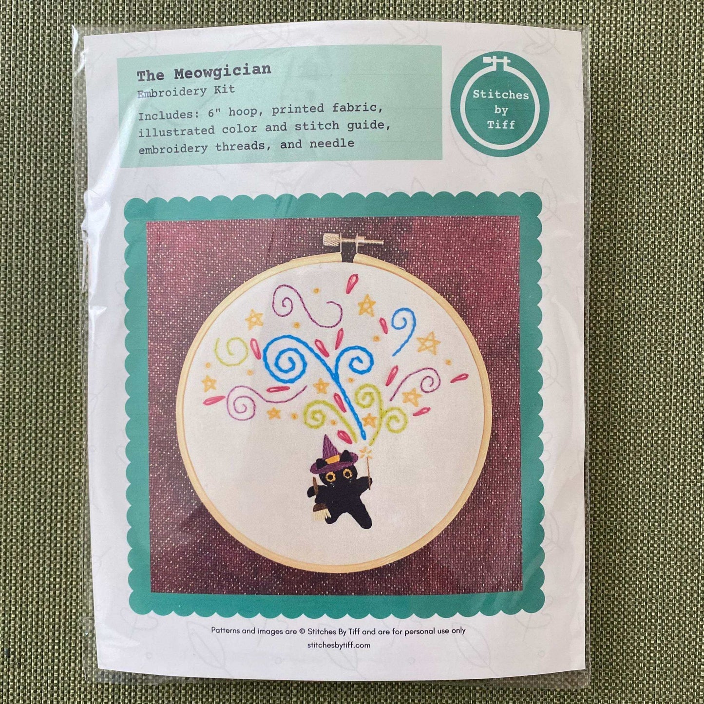 Embroidery kit featuring Percival the Meowgician design with colorful threads and textures for beginner stitchers.