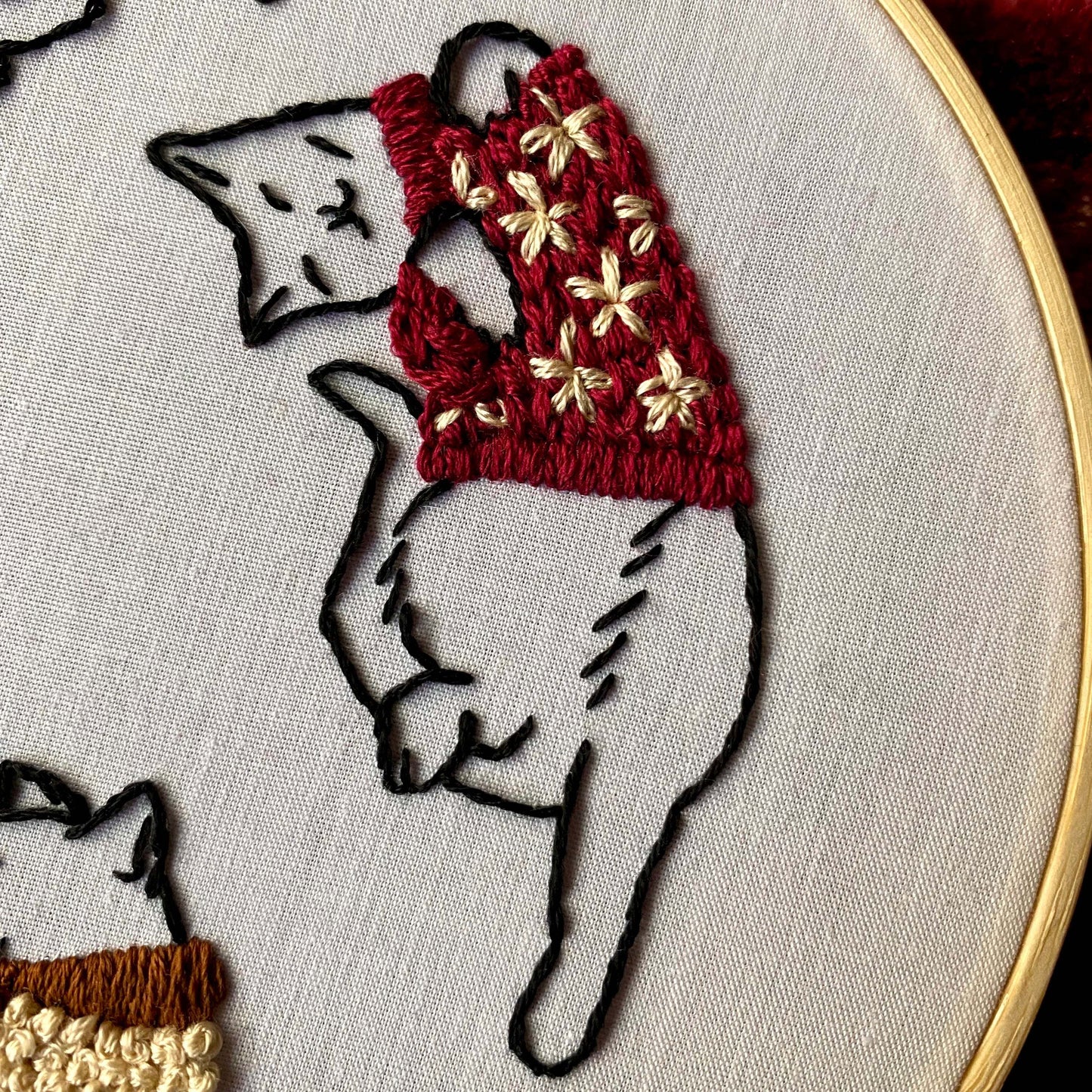 Embroidery kit with cozy cats in sweaters, 6-inch bamboo hoop, beginner-friendly design.