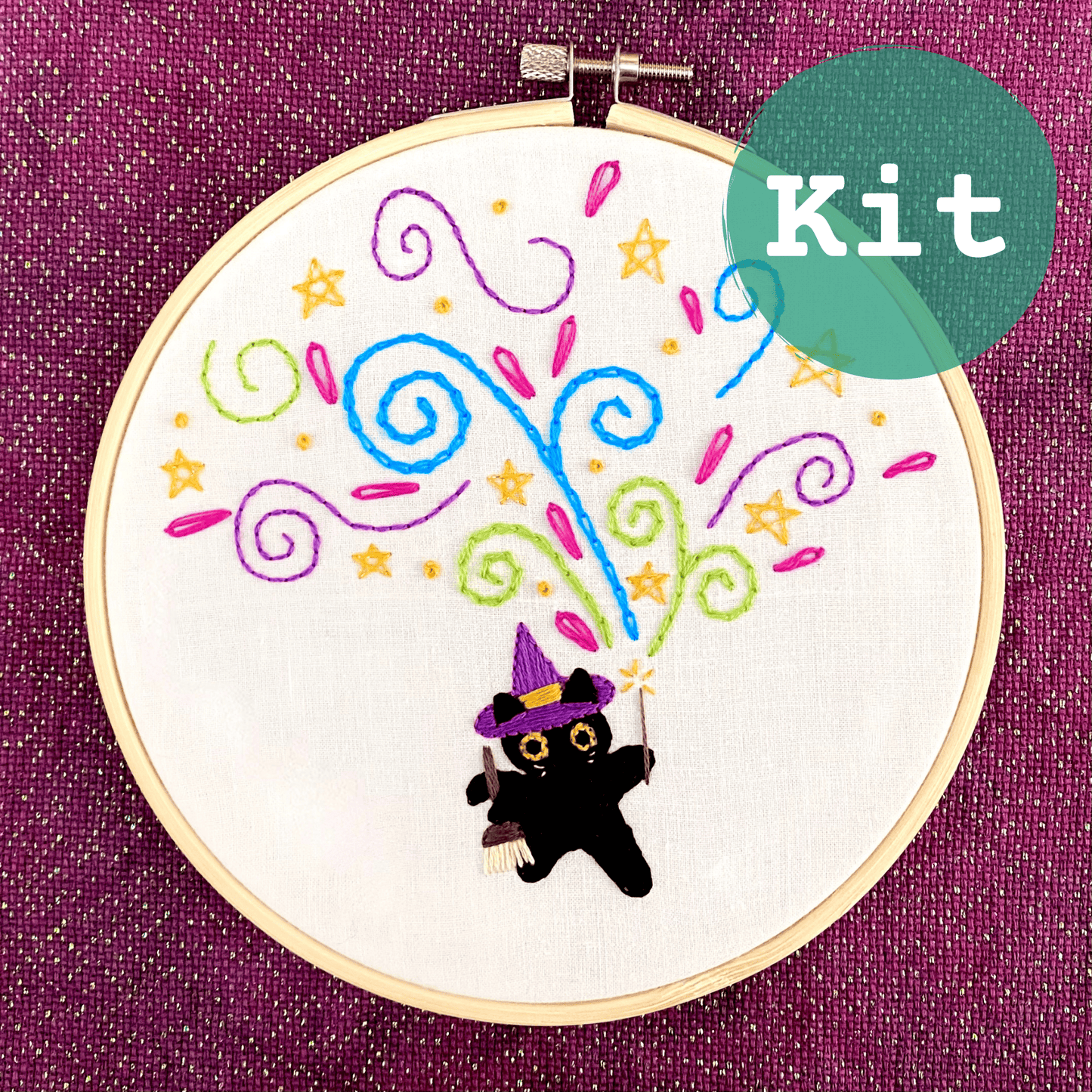 Embroidery kit with black cat design, featuring colorful threads and 6" hoop. Perfect for beginner stitchers.