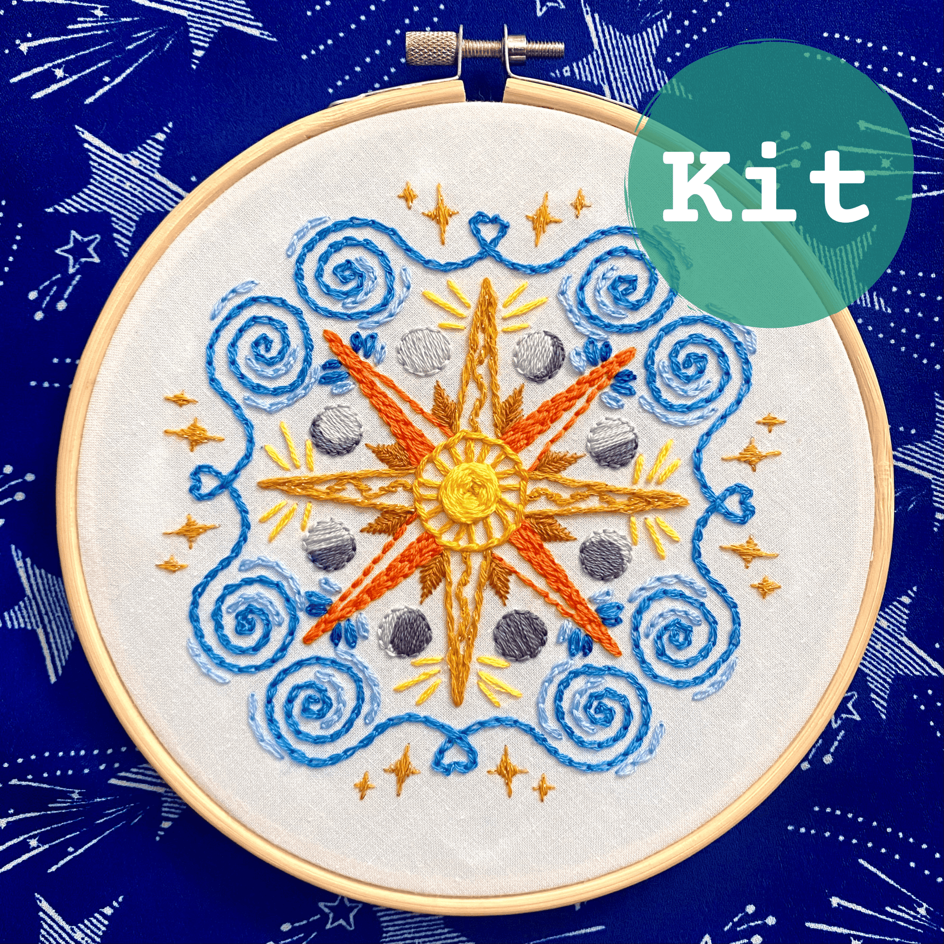 Celestial Mandala Sampler Embroidery Kit with sun, moon, stars design in bamboo hoop.
